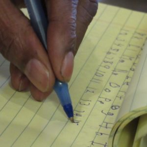Bobby practices his writing.