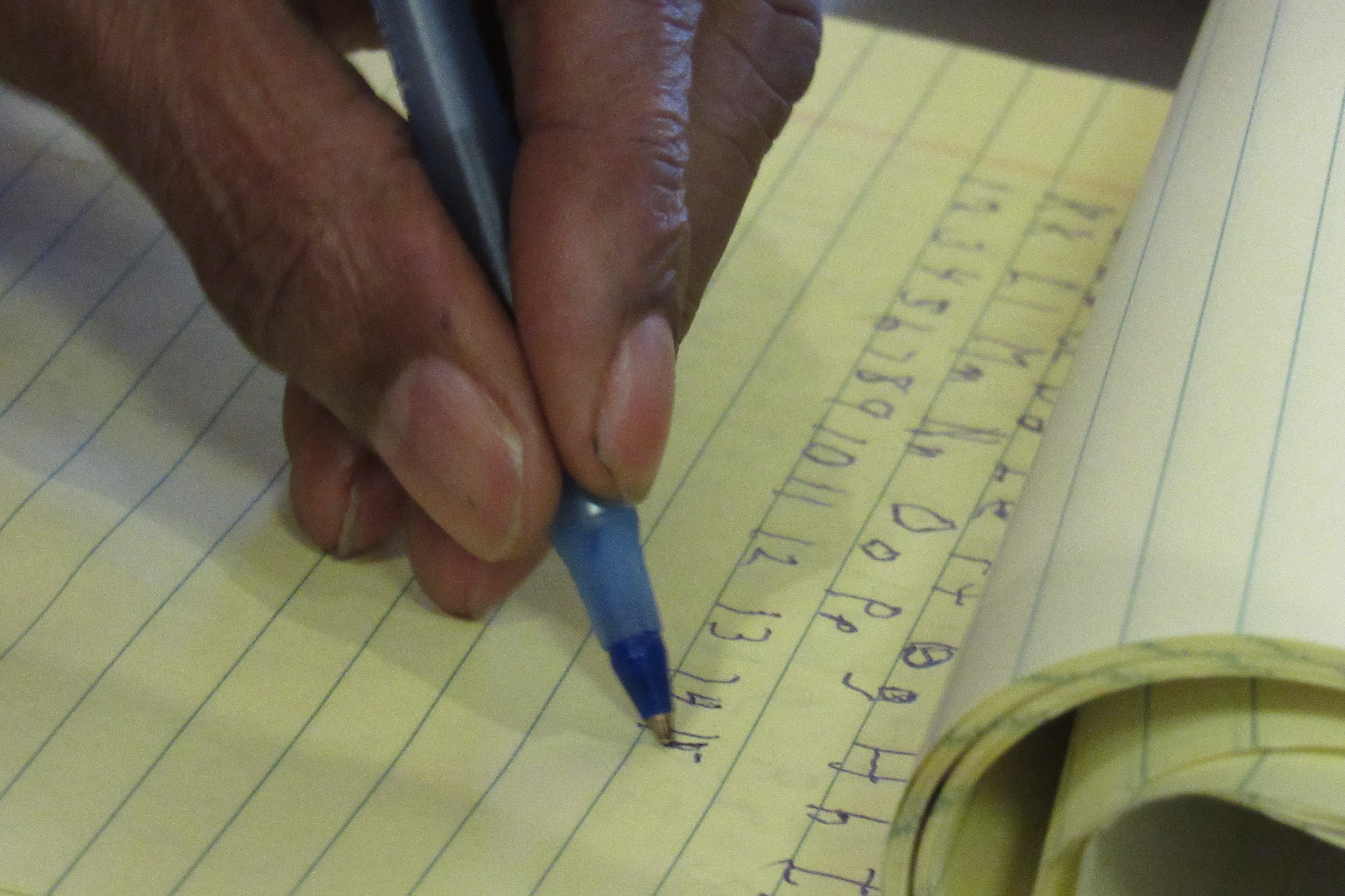 Bobby practices his writing.