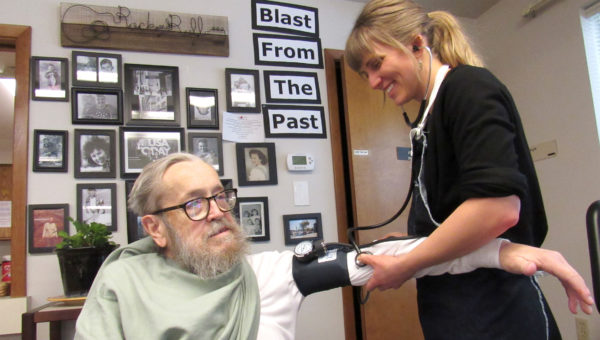 RN helps SHA resident.